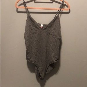 Grey body suit